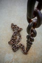 Rusty chain on floor Royalty Free Stock Photo