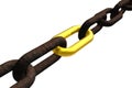 Rusty chain with golden link Royalty Free Stock Photo