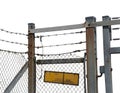Rusty chain link fence with barbed wire and yellow dirty sign