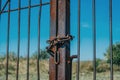 Rusty chain on a metal gate Royalty Free Stock Photo