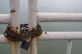 Rusty chain with padlock on the gate