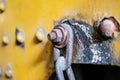 Rusty chain on rusted nut closeup - industrial detail