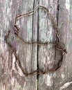 Rusty chain. Rusty chain links on a background of old wood. Royalty Free Stock Photo