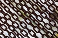 Rusty chains. Background of chains on a withe background. Rust Anchor Chain. Curtain of old chain-link. Background of Royalty Free Stock Photo