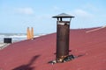 Rusty chimney on the roof Royalty Free Stock Photo