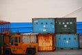 Rusty containers and forklift Royalty Free Stock Photo