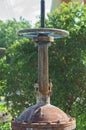 Rusty controlling faucet crane. Round handle of water supply valve close-up. Industrial heating and water supply systems Royalty Free Stock Photo