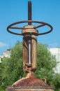 Rusty controlling faucet crane. Round handle of water supply valve close-up. Industrial heating and water supply systems Royalty Free Stock Photo