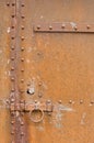 Rusty, corroded old metal door, latch and bolts Royalty Free Stock Photo