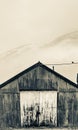 Rusty corrugated iron shed on misty morning