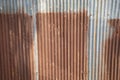 Rusty corrugated metal tin, aluminium, iron, steel plates with beautiful color show vertical line texture with fringe and Royalty Free Stock Photo