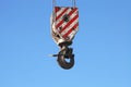 Rusty crane hook hanging on blue sky Royalty Free Stock Photo