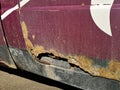 Rusty and dirty car door damaged by corrosion. Hole in the door car Royalty Free Stock Photo