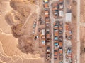 Rusty and dirty construction campsite and earthworks in the sands top aerial view