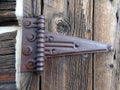 A rusty door hinge mounted on a door frame Royalty Free Stock Photo