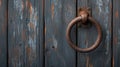 Rusty door knocker on weathered wooden door closeup shot Royalty Free Stock Photo