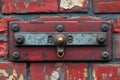 Rusty door latch on weathered brick wall reveals stories of time and use in urban setting. Generative AI
