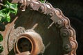 Rusty driving gears with chain on a old mine train wagon