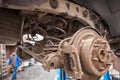 Rusty drum brakes, front on car. Change the old to new brake disc on car in a garage. Auto mechanic repairing Royalty Free Stock Photo