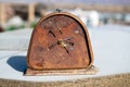 Rusty face of a broken alarm clock