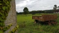 Rusty Farming Carrier on weels at the countryside Royalty Free Stock Photo