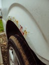 Rusty front wing of a car.