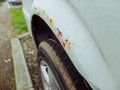 Rusty front wing of a car.