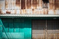 Rusty galvanized steel and green wood for texture background. Royalty Free Stock Photo