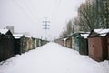 Rusty garages in winter, suburban area in russian town