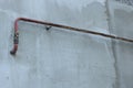 Rusty gas pipe at light wall outdoors, low angle view Royalty Free Stock Photo