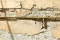 Rusty gas pipe on old wall outdoors Royalty Free Stock Photo