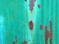 Rusty green mint metal wall with brown patterns. metal rust texture background Royalty Free Stock Photo