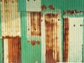 Rusty green painted metal wall with cracked paint, texture color Royalty Free Stock Photo