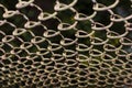 Erspective view of a rusty and dirty chained fence in the park - Old braided wire wall used for protection Ã¢â¬â Rough textured