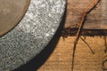 Rusty grindstone in workshop. whetstone close up