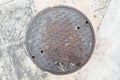 Rusty, grunge manhole cover NOT isolated Royalty Free Stock Photo