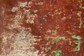 Rusty and grungy metal iron plate wall with the typical ferric oxide red color and with green peeling coating texture background Royalty Free Stock Photo