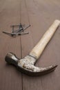 Hammer and nails on wooden surface Royalty Free Stock Photo