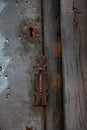 Rusty Handle And Lock Of An Old Rustic Wooden Door Painted In Gray