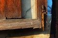 The rusty hasp of the old and broken wooden window of Chinese house Royalty Free Stock Photo