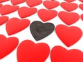 A rusty heart between red hearts on a white Royalty Free Stock Photo