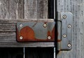 Rusty hinge creates textured pattern