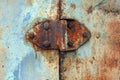 Rusty hinge on old rusted iron door, close-up Royalty Free Stock Photo