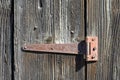 Rusty hinge on old wooden door Royalty Free Stock Photo