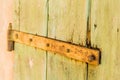 rusty hinge of an old wooden door of country barn Royalty Free Stock Photo