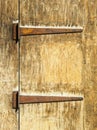Rusty hinges on an old wooden door Royalty Free Stock Photo