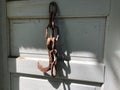 Rusty Hook Hanging from a Door Royalty Free Stock Photo