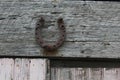 Rusty Horse Shoe  Hanging Outside a Weathered Building Royalty Free Stock Photo