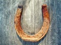 Rusty Horseshoe on Wooden Barrel