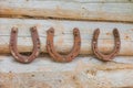 The rusty horseshoes on an old wooden wall Royalty Free Stock Photo